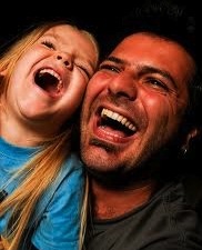 father and child laughing
